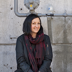 Photo of Jane Vorbrodt in front of concrete wall